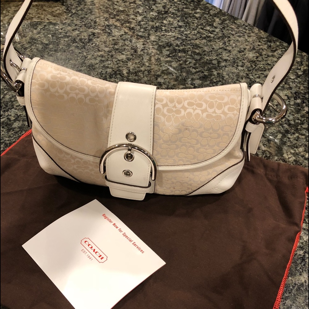Coach authentic white purse with buckle.